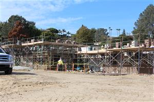 Two-story classroom building masonry underway 