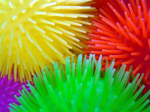 Four stretchy gel balls - red, yellow, & green 