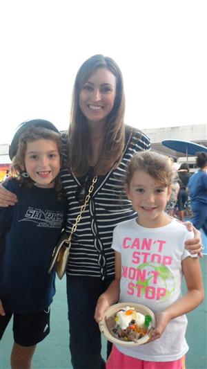 Picture of a Solana Highlands family at a school event including two kids and one parent