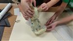 Students working with paper mache 
