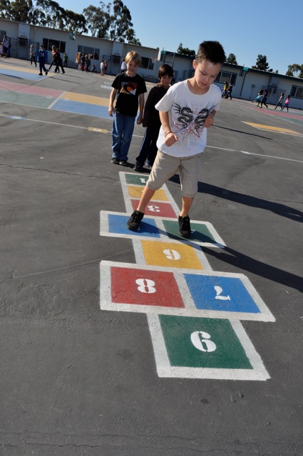 Student playing hopscotch during Physical Education 