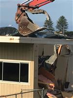 Claw of Tractor over Building 