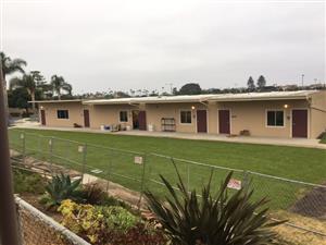 four classroom buildings with landscape 