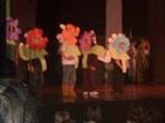 Students dressed as flowers in a play 