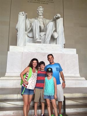 Trusso family standing in front of the Lincoln Monument