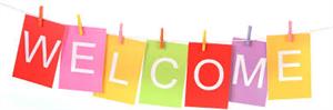 7 Multicolored papers held on a string with clothespins spelling the word welcome 
