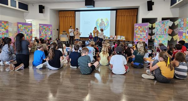 Newbery Medalist Matt de la Pena shares his book with students in an assembly